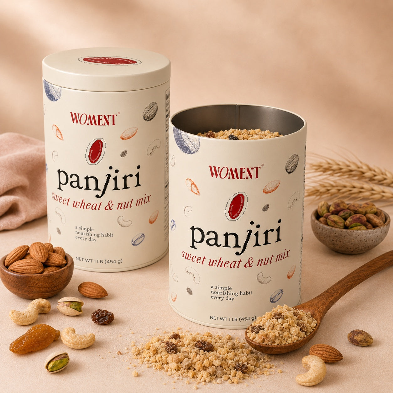 Two WOMENT panjiri tins, one open showing the roasted blend