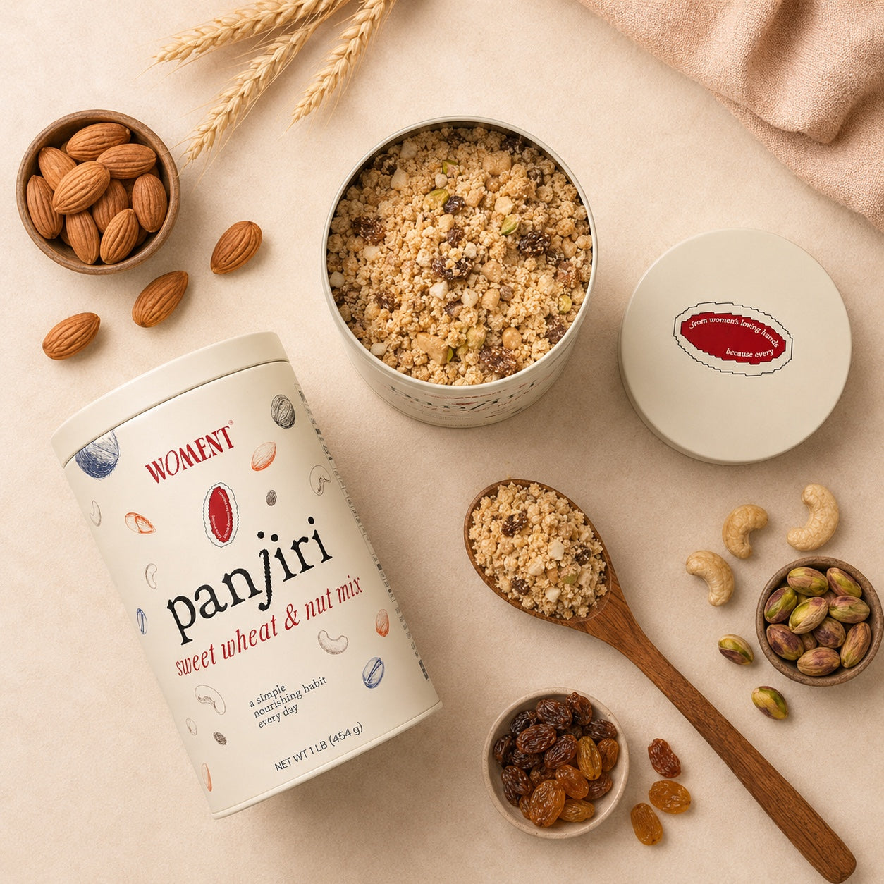 Open tin of WOMENT panjiri from above with nuts and dried fruit